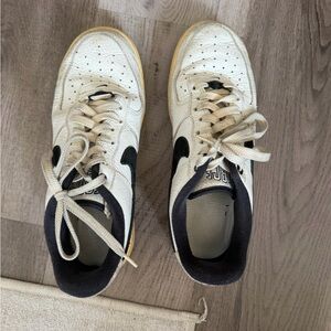 Nike White Sneakers with Black Swoosh and Yellowed Soles. Size 9